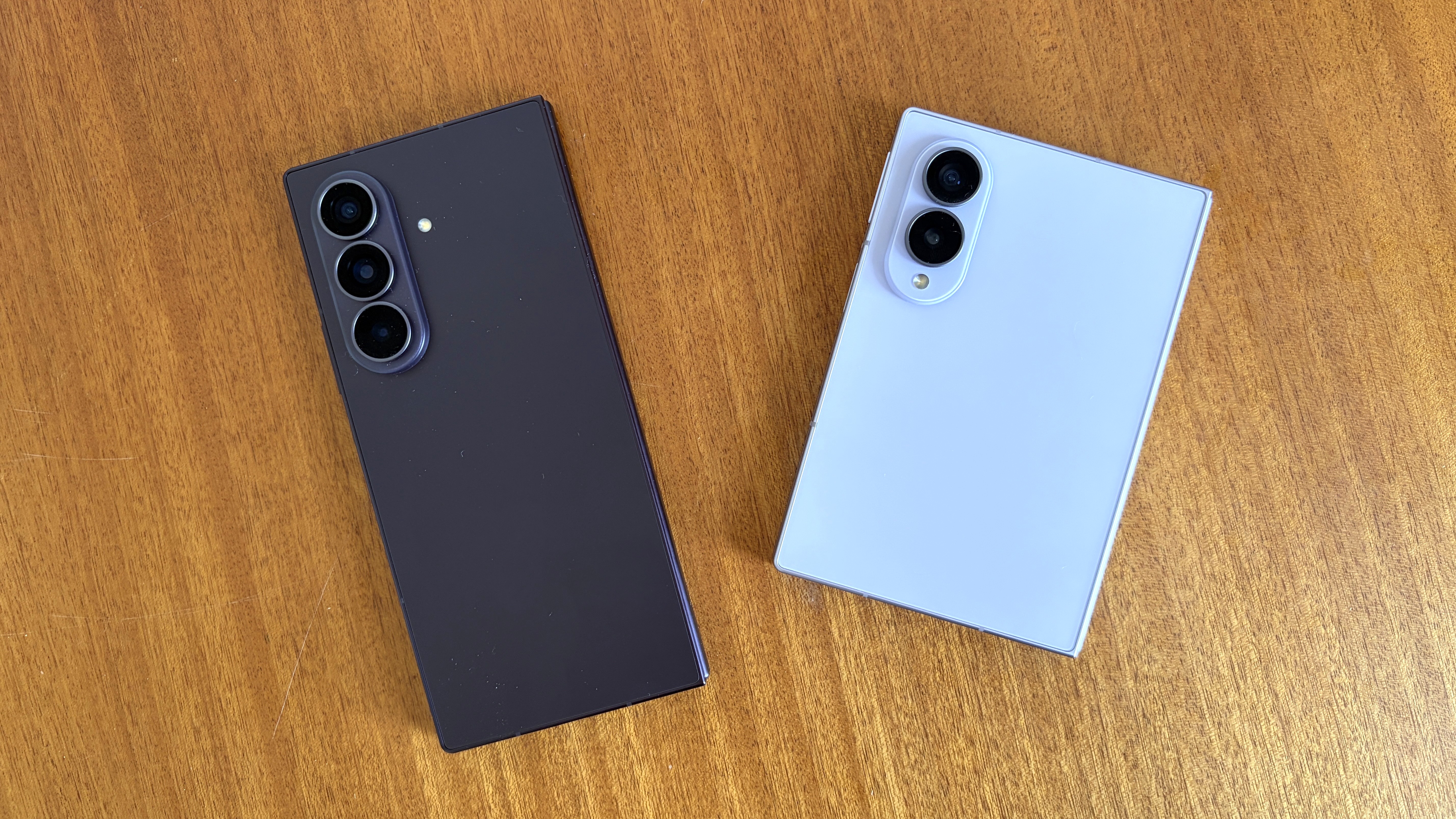 The Samsung Galaxy Z Fold 8 Ultra and Samsung Galaxy Z Fold 8 on a wooden table