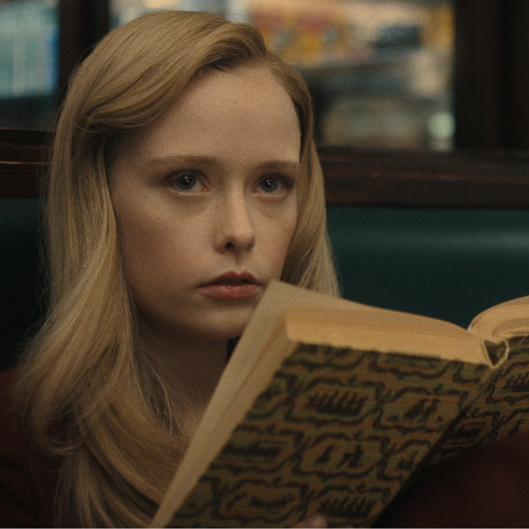 suzanna son as adeline reading a book in monster the ed gein story