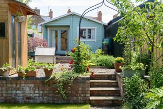 tiered garden ideas: steps leading to summer house