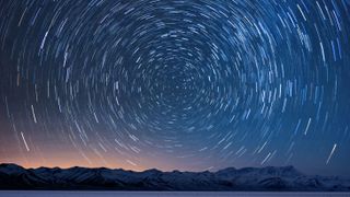 Best intervalometers: Image shows star trails over snowy mountains