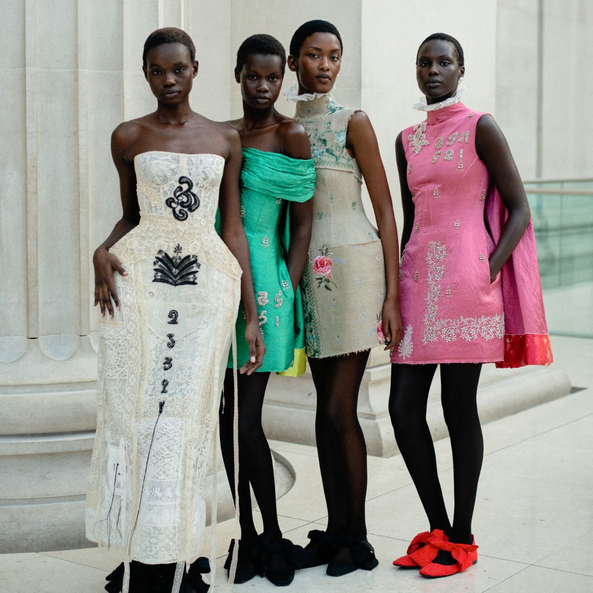 four models backstage at the erdem ss26 fashion show