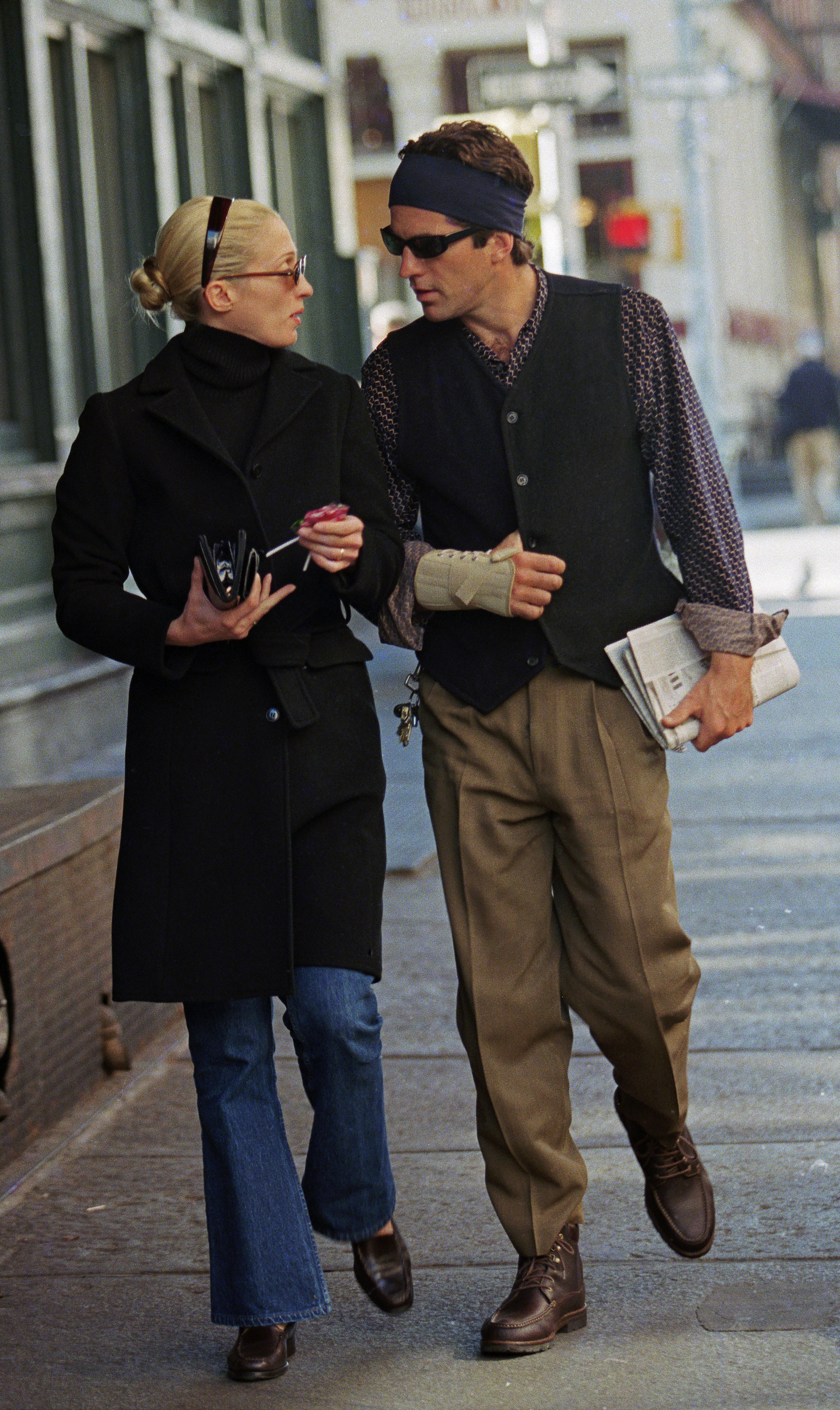 John F. Kennedy Jr., with his injured hand wrapped in a bandage, strolls in Tribeca with wife, Carolyn Bessette Kennedy after brunch at Bubby's. October 18, 1997.