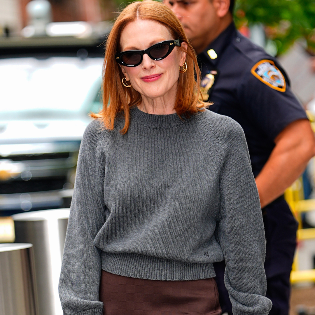 Julianne Moore in New York City wearing a crewneck sweater with a brown skirt and Bottega bag