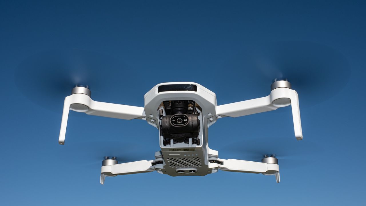 Potensic Atom 2 in flight against a blue sky