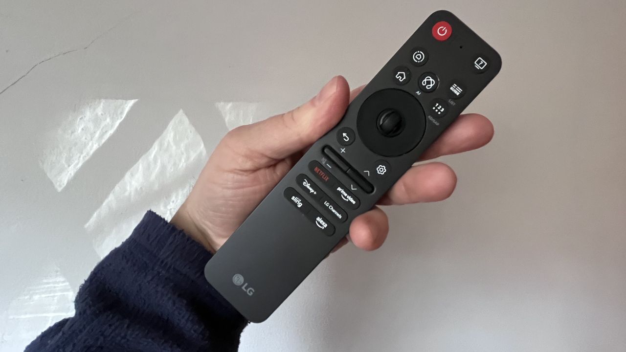 LG G5 OLED TV remote control held in reviewer's hand