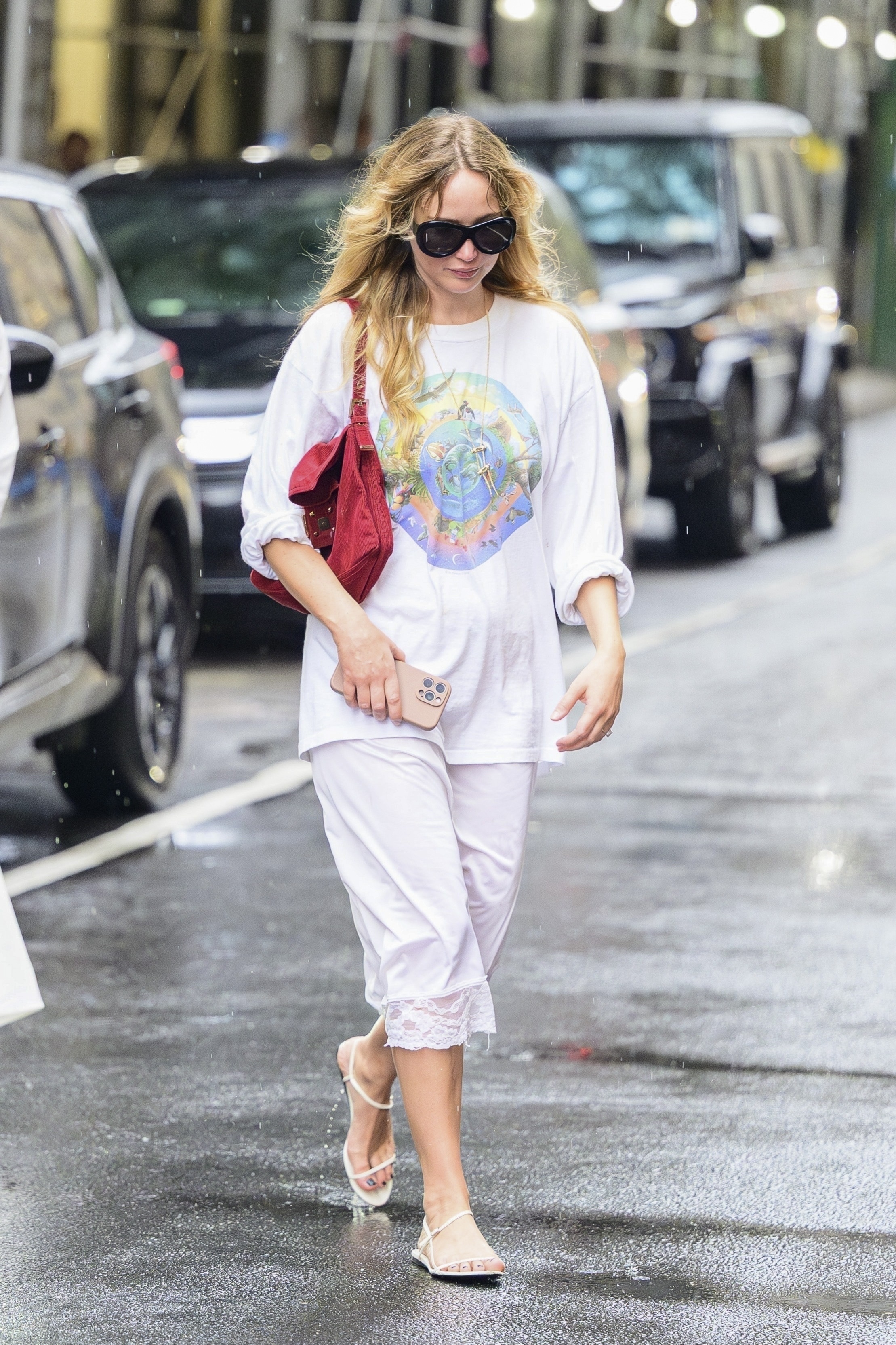 Jennifer Lawrence rewore her summer outfit formula, white lacy pants with The Row sandals