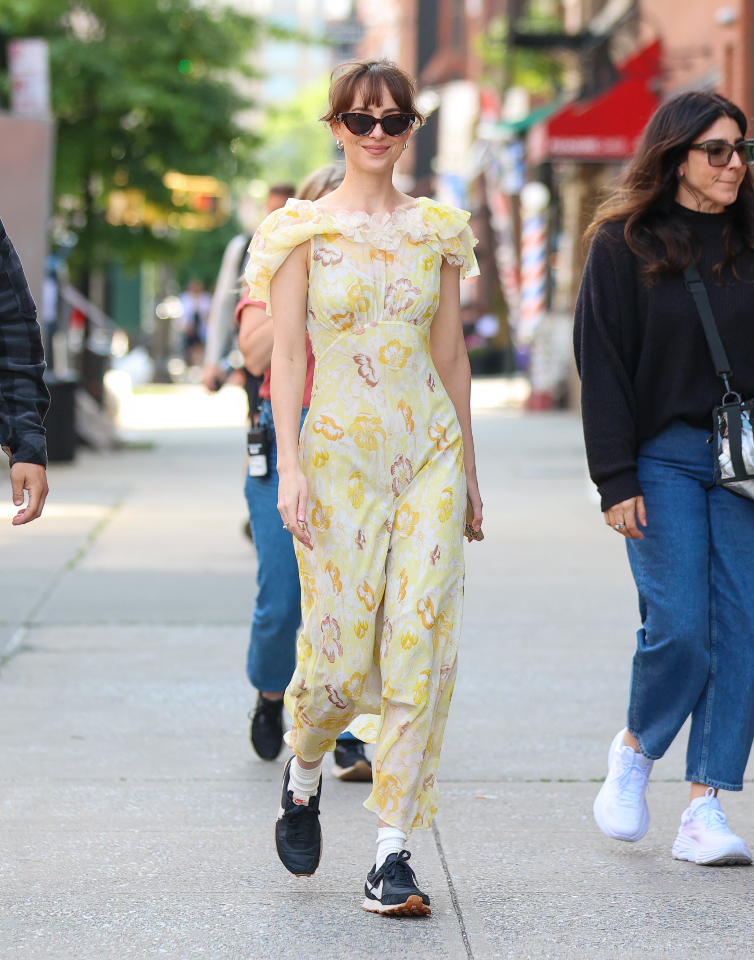 Dakota Johnson wears Adidas Daybreak sneakers in NYC.