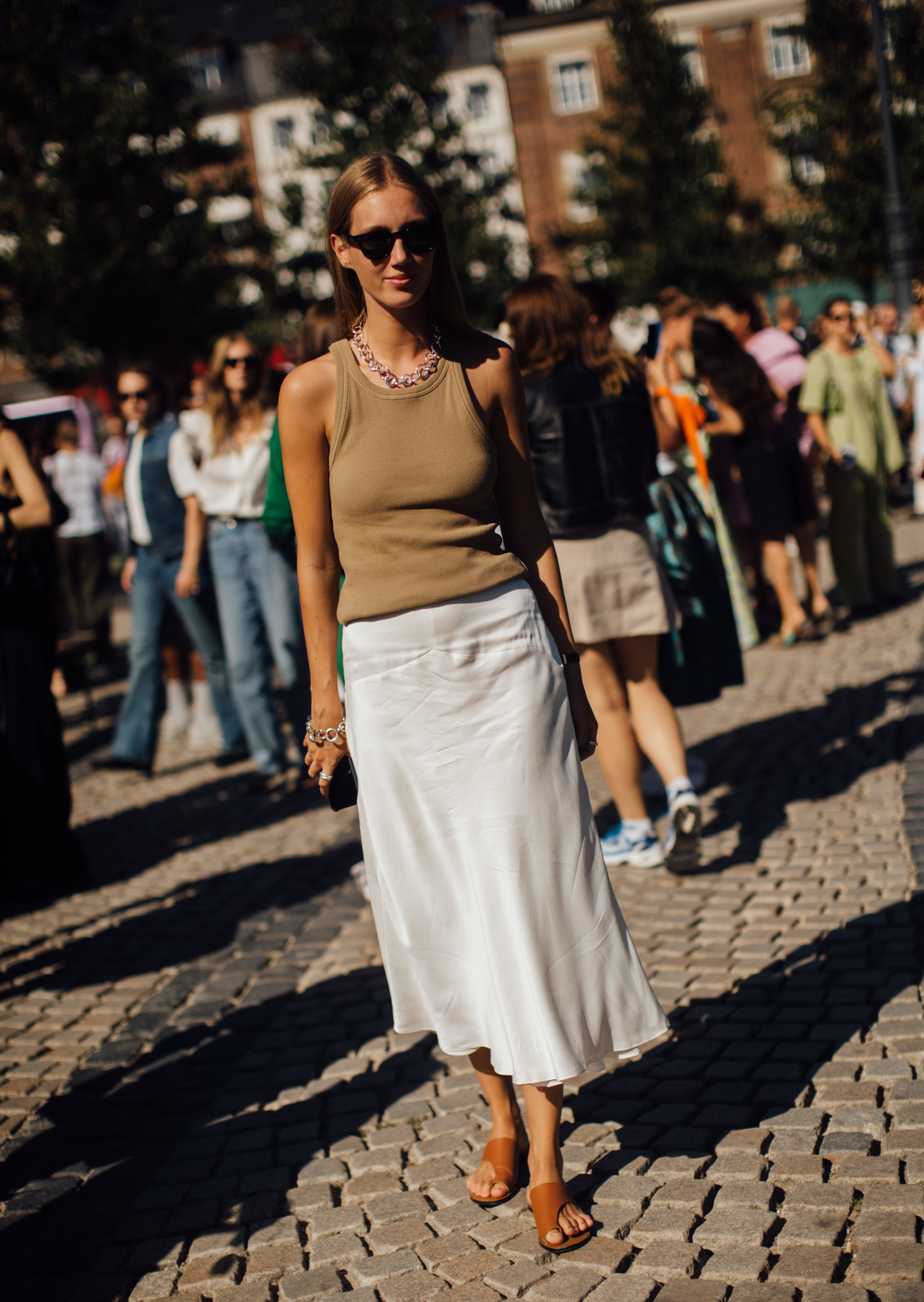 woman wearing tank top, skirt, and sandals