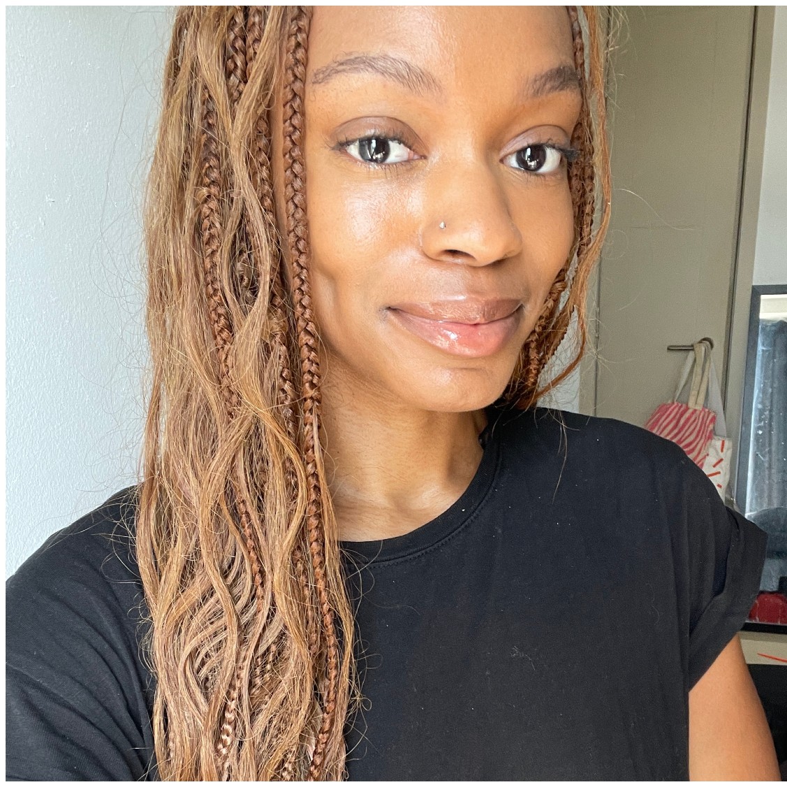 a person with brown hair in front of a white background