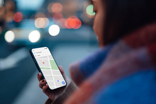 Woman using GPS navigation app on smartphone