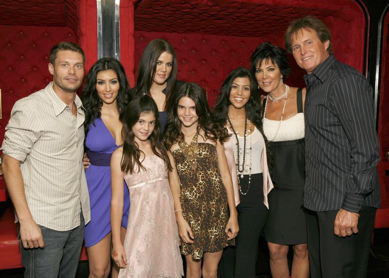 the kardashians pose with ryan seacrest at an event for Keeping Up With the Kardashians