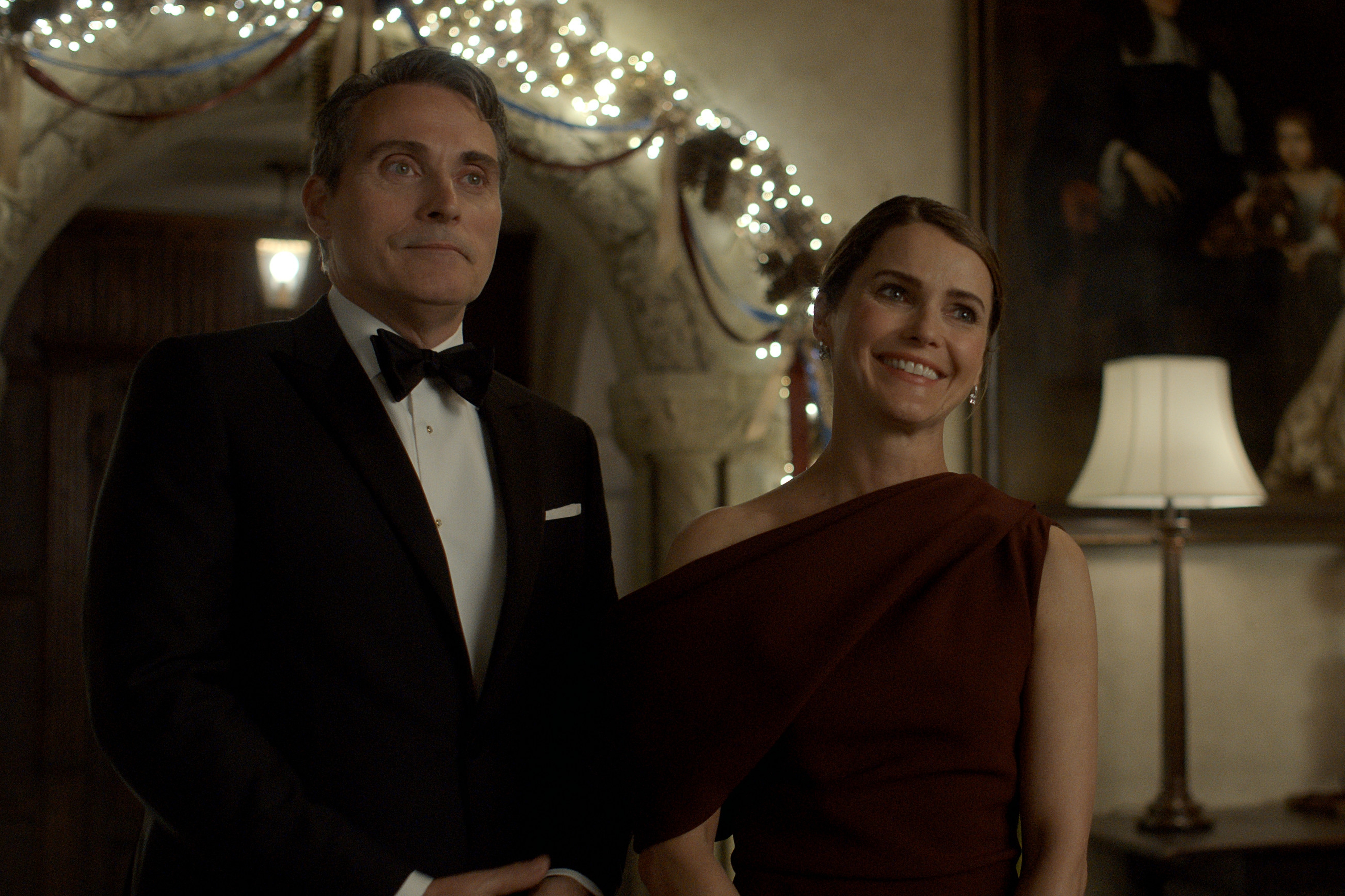 rufus sewell and keri russell as hal and kate wyler at a formal political event in the diplomat season 3