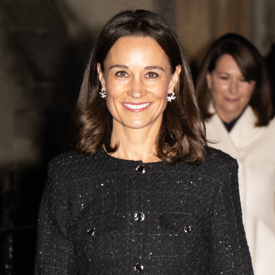 Pippa Middleton wearing a sparkly black coat and smilig 