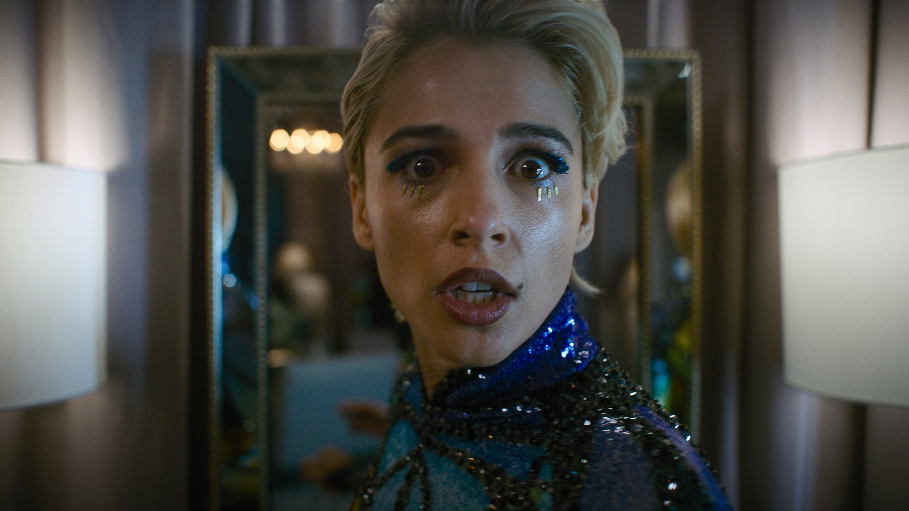 Naomi Scott as a popstar looking scared and running down a hall in &#039;Smile 2&#039;