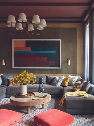 Living room with burgundy ceiling and in-ceiling speakers