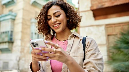 woman outside using phone