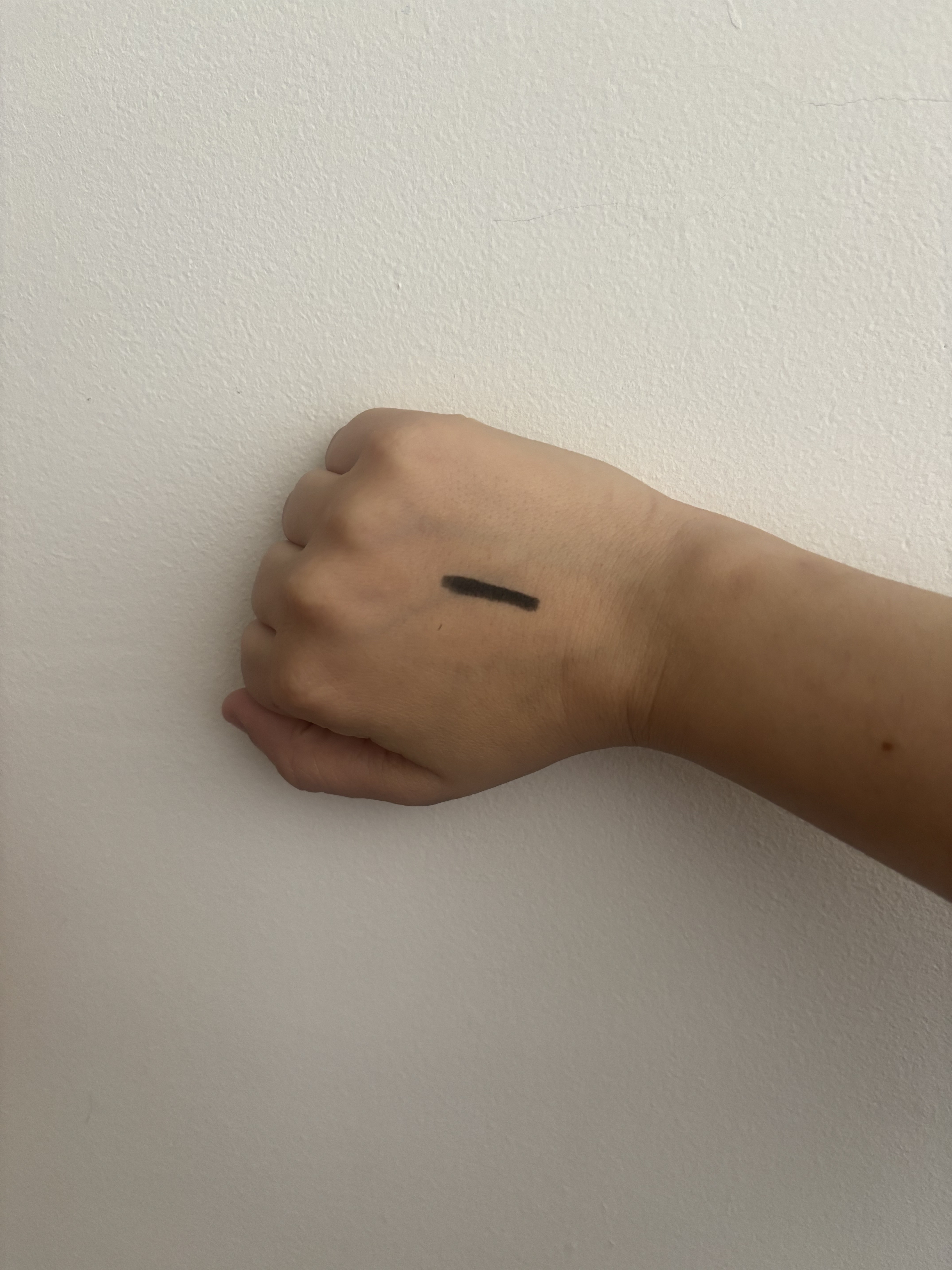 swatch of black Kevyn Aucoin Precision Eye Definer on back of hand