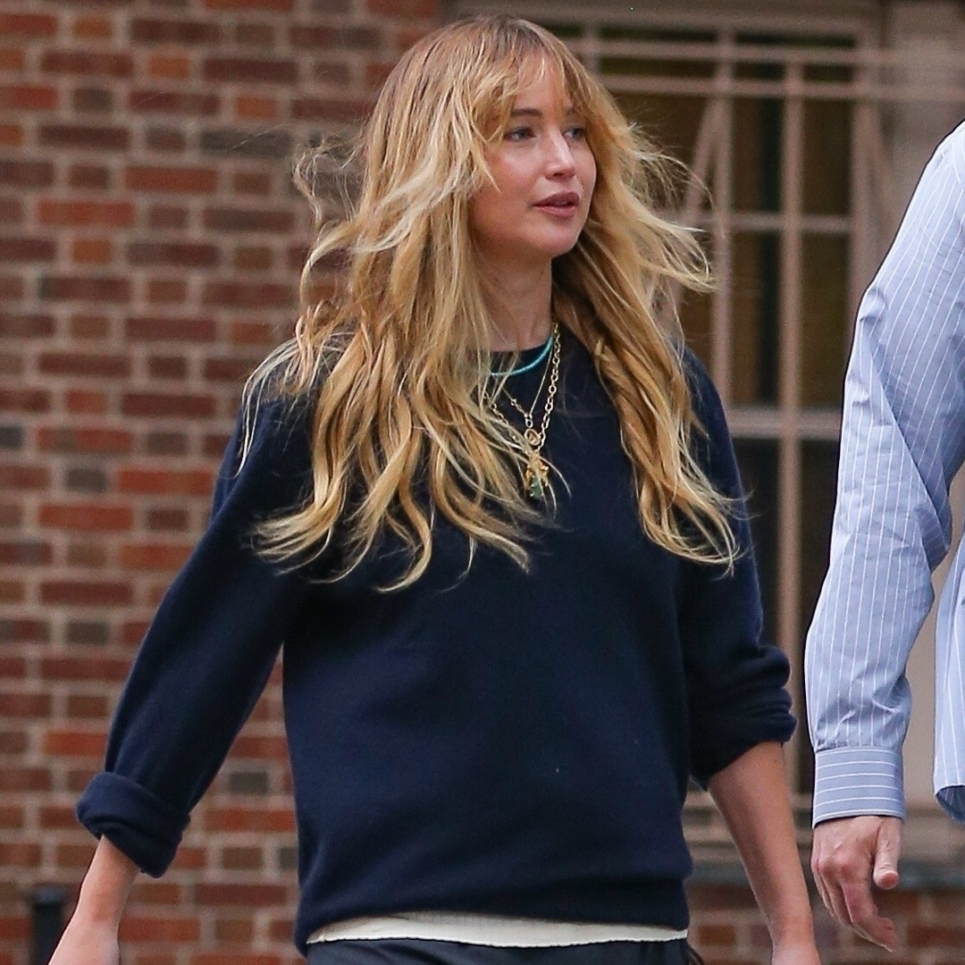 Jennifer Lawrence styled a navy sweater with her favorite skirt-pants and a Dior bowling bag