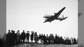 Berliners await deliveries of supplies from U.S. planes during the Berlin Airlift.