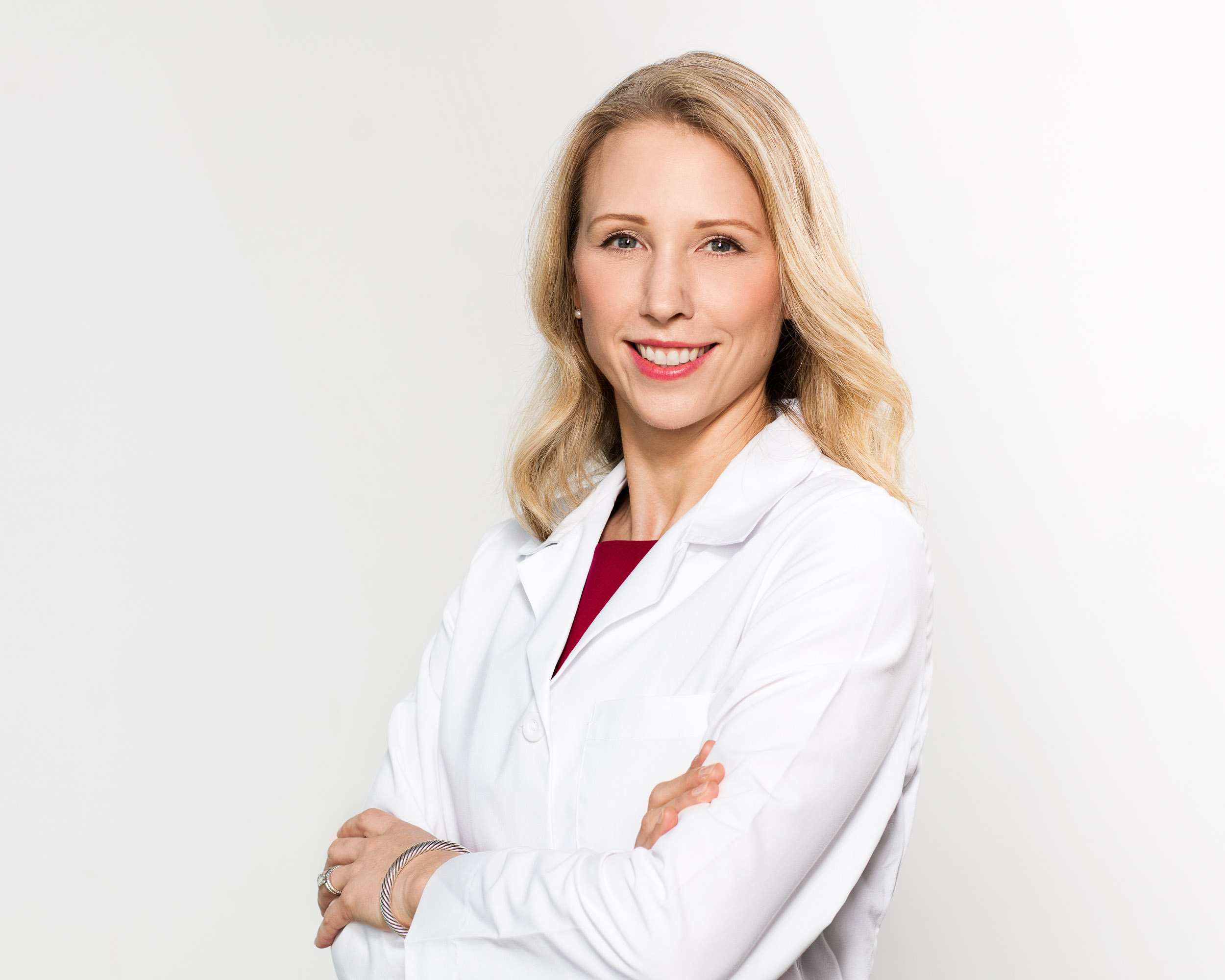 Dr. Geraghty headshot in a white lab coat