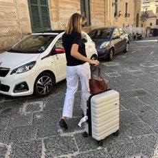 Girl in Europe with suitcases