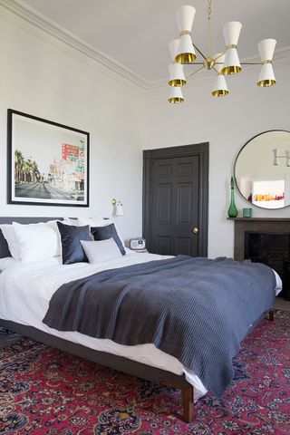 Bedroom with fireplace and dark grey doors