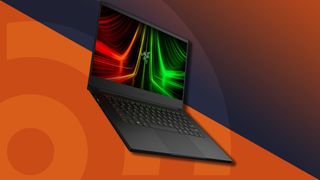 A Razer blade 14, currently the best gaming laptop, against an orange techradar background