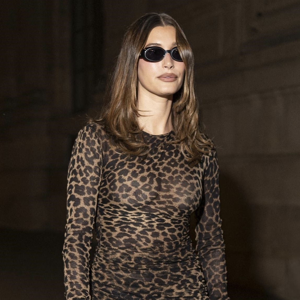 Hailey Bieber was spotted leaving Loulou club during Paris Fashion Week, rocking a leopard print dress paired with high boots and platform heels. The model’s chic style was elevated with black sunglas