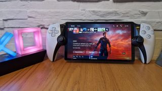 PlayStation Portal device on a desk accompanied by PS lights