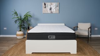 The Plank Firm Luxe mattress in the Tom;s Guide Sleep Lab, dressed to look like a bedroom