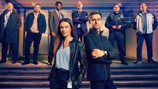 The cast of The Blame stand outside a fake police station