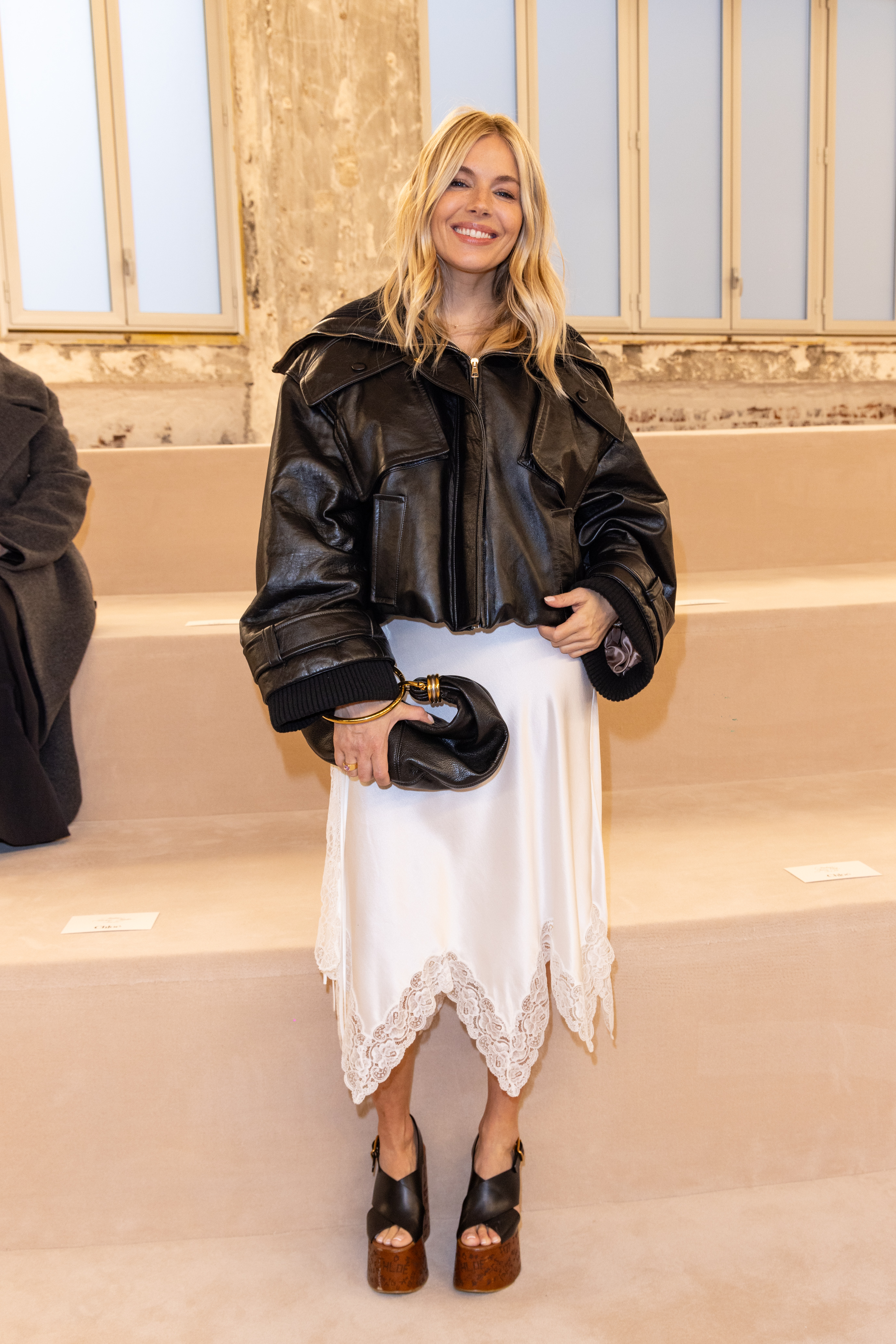 Sienna Miller wore a white lace-trimmed skirt at the Chloé Fall/Winter 2024/25