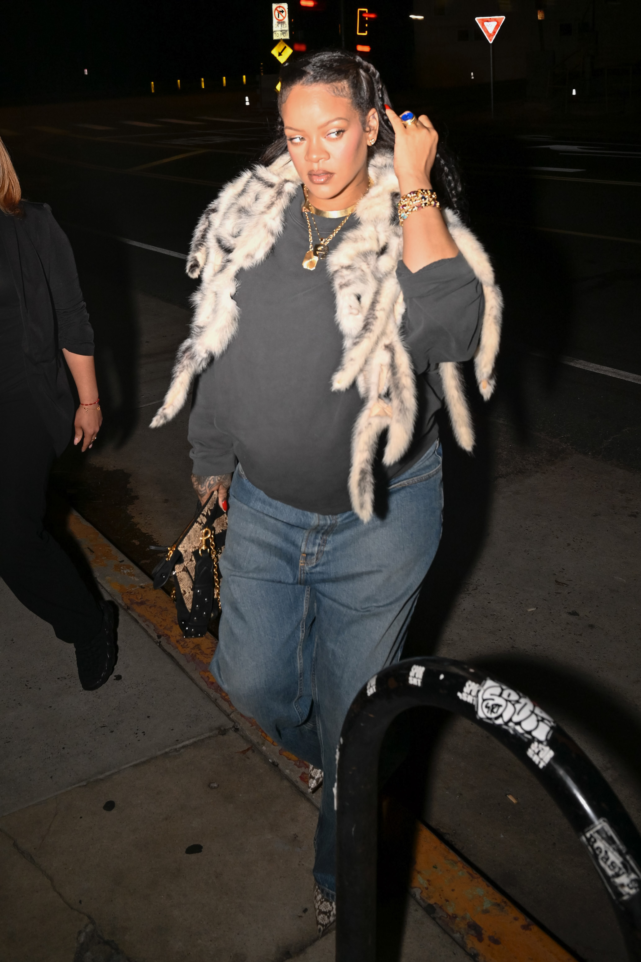 RIhanna wore the fur shawl trend in early August