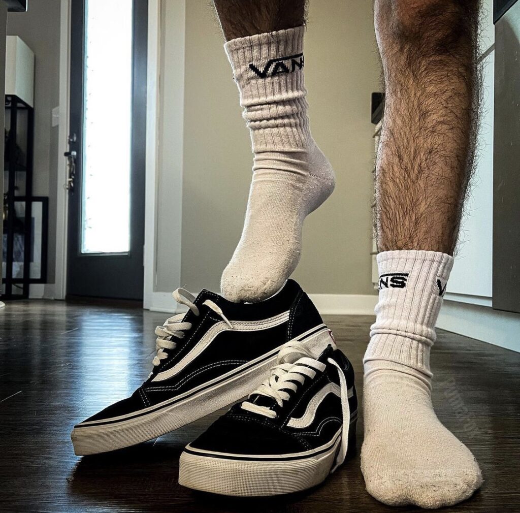 Pumafox in white Vans crew socks out of Vans sneakers