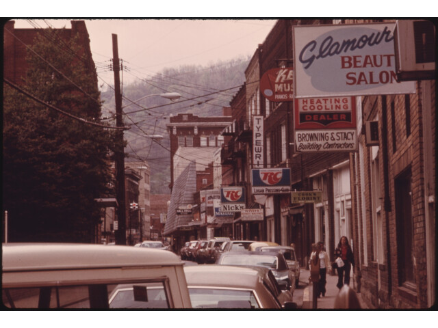 MAIN STREET OF LOGAN  WEST VIRGINIA  SHOWING A NARROW STREET WITH PARKING ON ONLY ONE SIDE WHICH IS TYPICAL IN MANY... - NARA - 556422 image