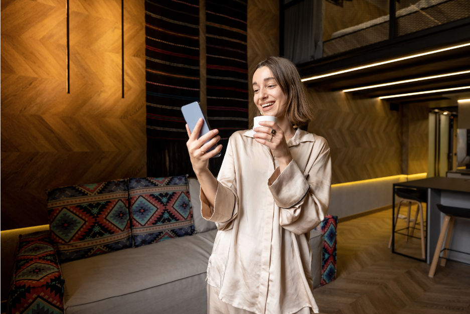 Female Hotel guest laughing at phone