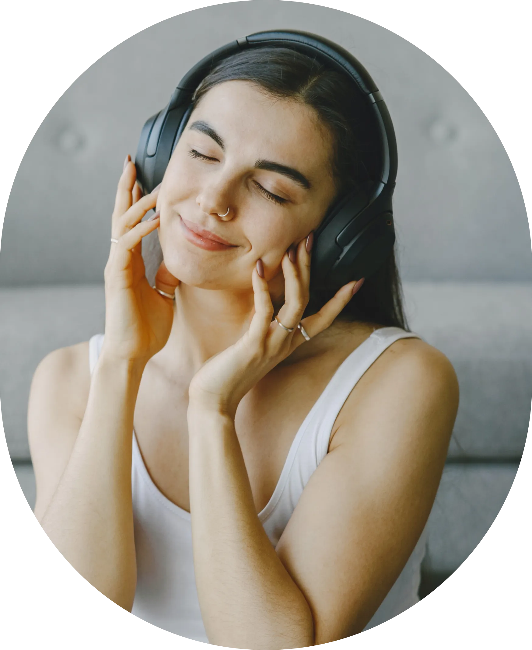 An image of a mixed-race woman wearing headphones