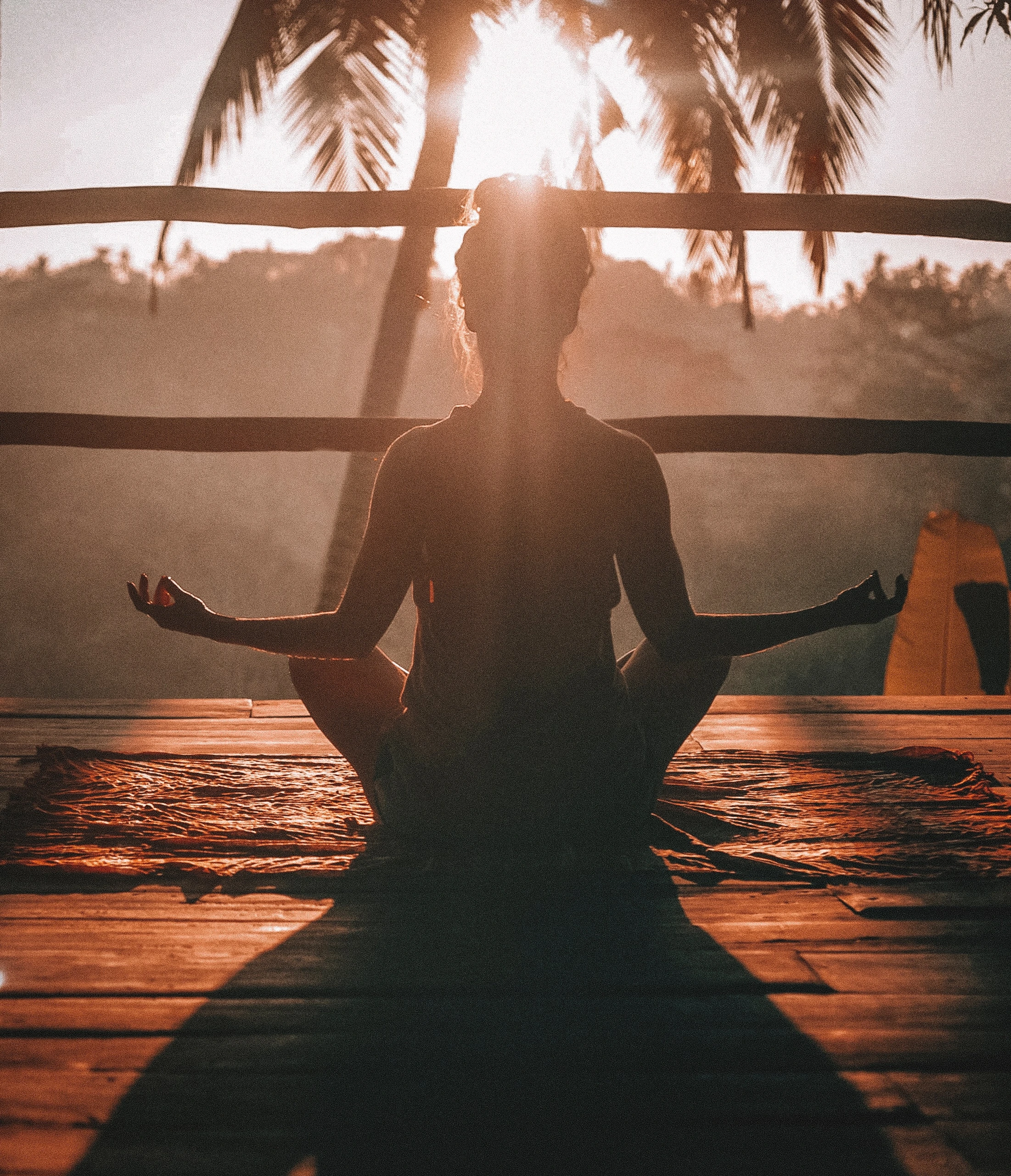 Woman doing yoga on her balcony while practising Kung Fu Breathing