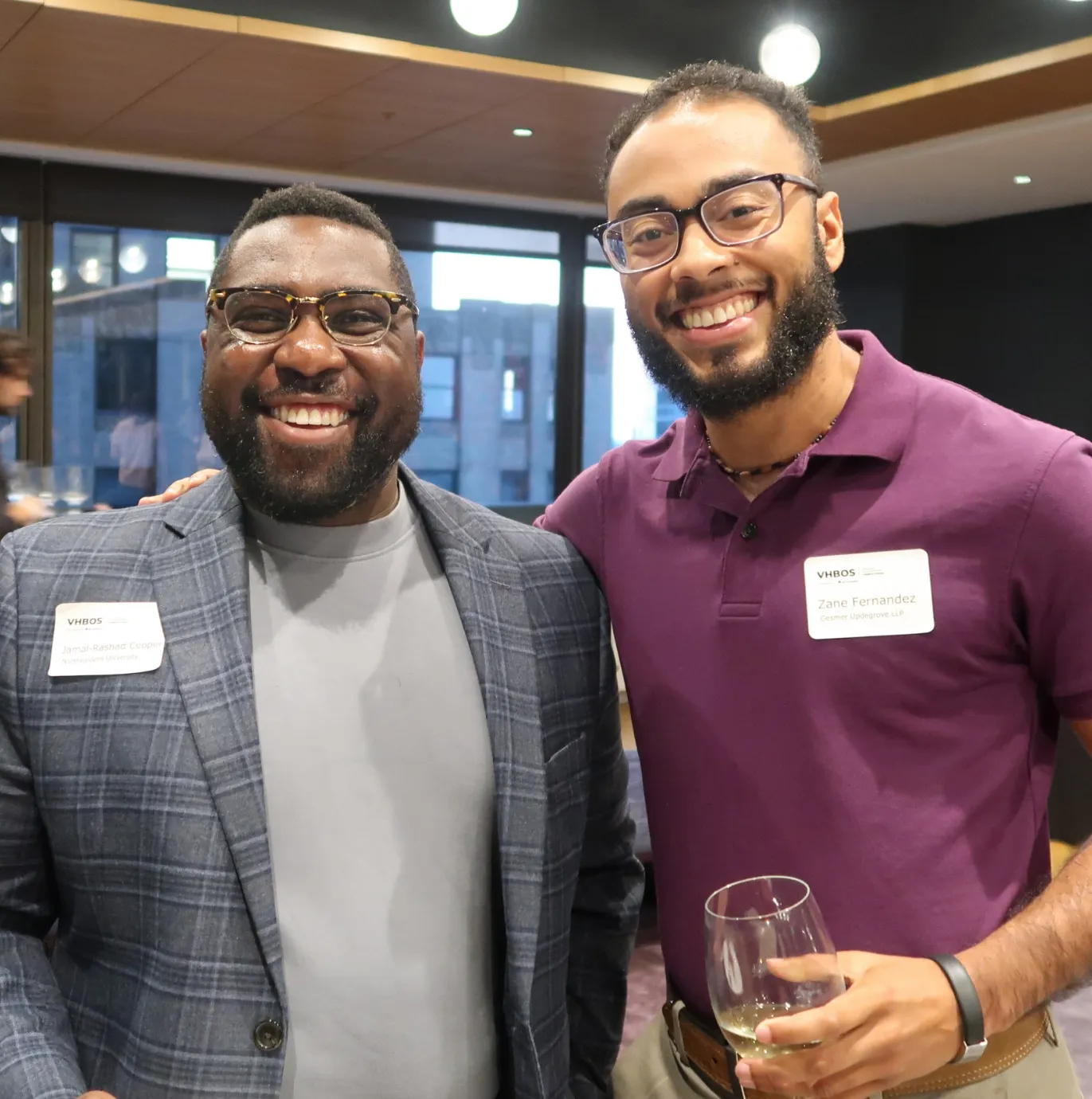 Two founders smiling at the camera during the VHBOS Program