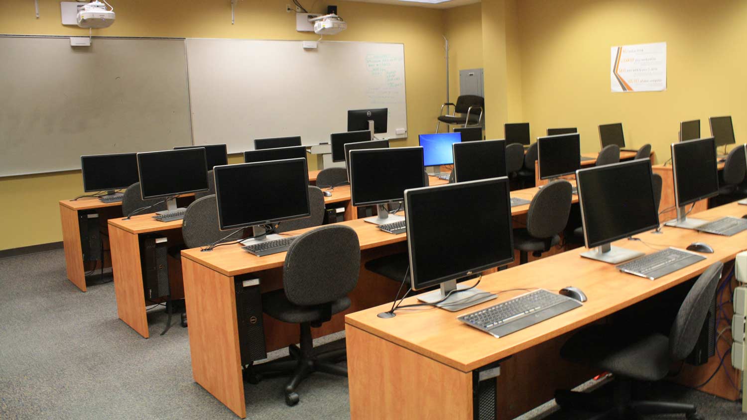 Computer lab with wooden desks