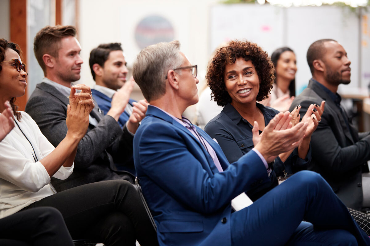 People applauding a presentation