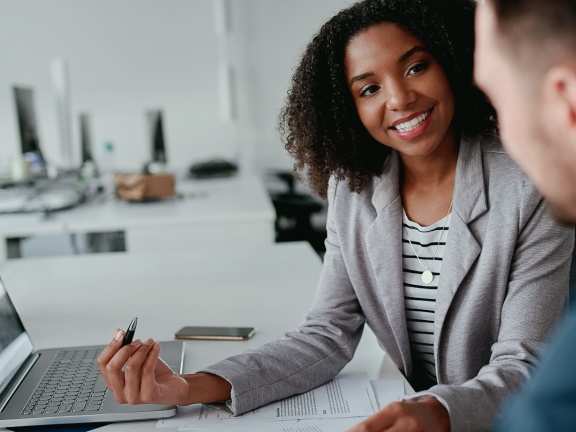 stock photo: two coworkers at a desk