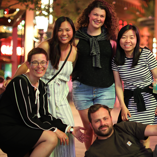 Five MacPherson's employees standing together and smiling while having their picture taken