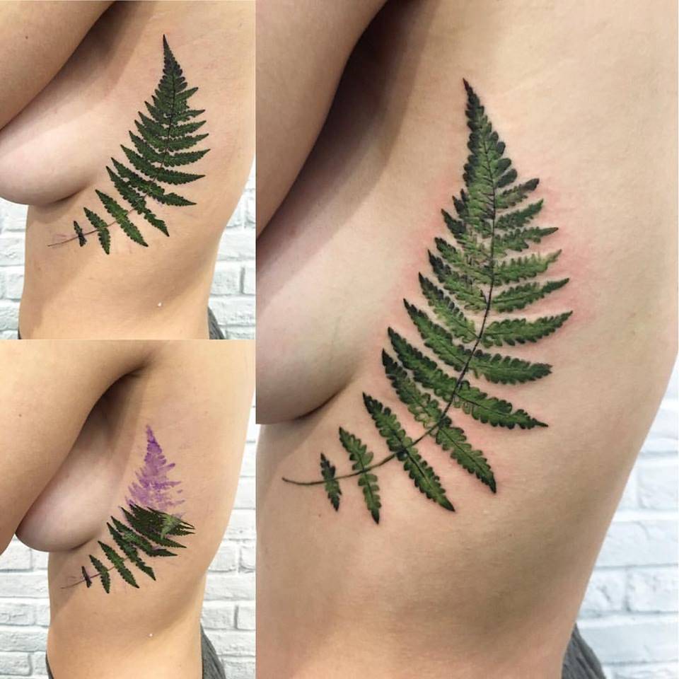 Realistic fern tattoo using a real leaf as a stencil.