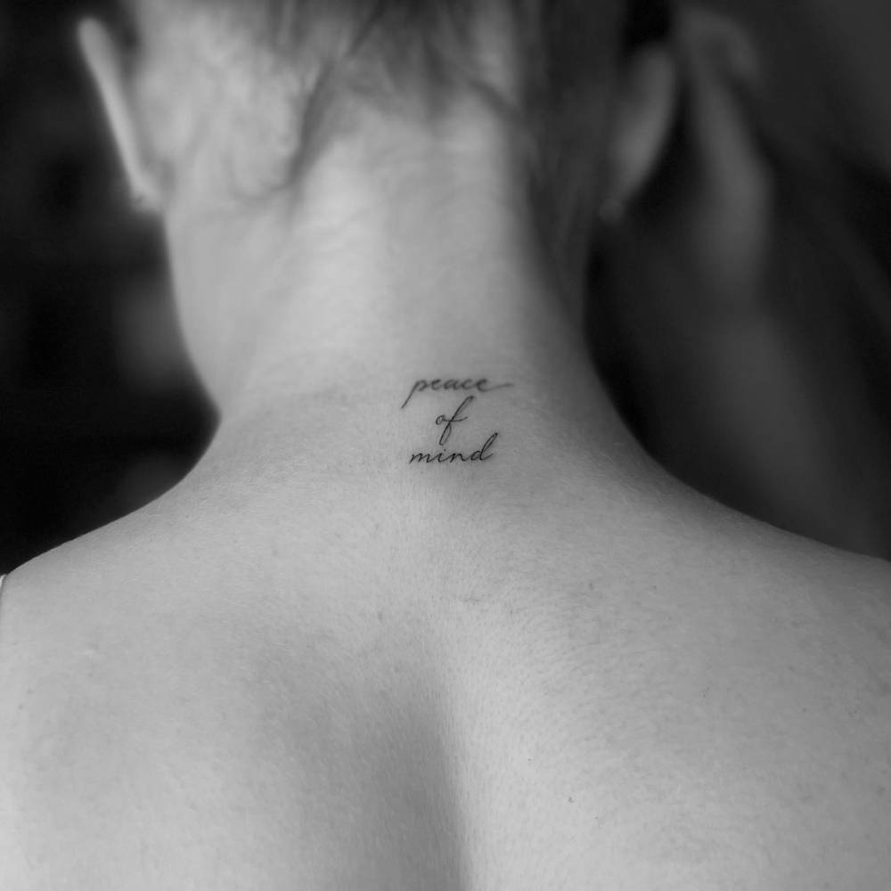 "Peace of mind" lettering tattoo located on Keira Walsh's back of neck.