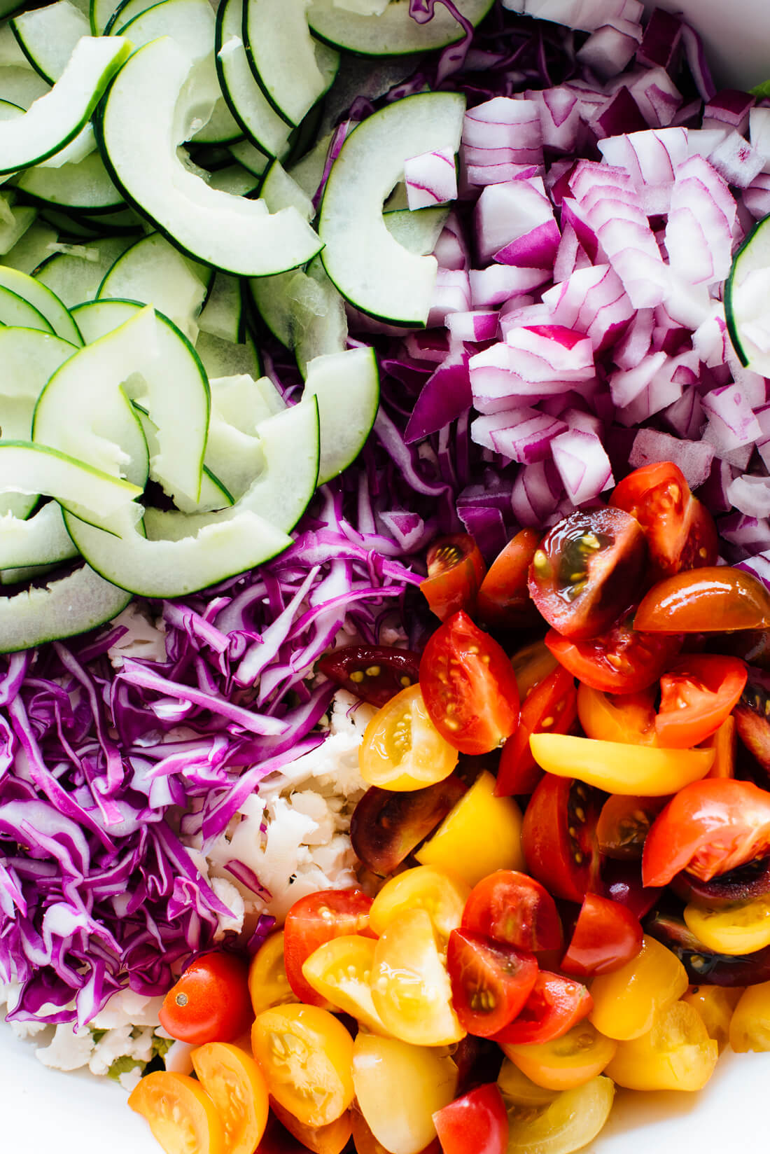 Mexican chopped salad featuring chopped romaine, cabbage, cauliflower, cherry tomatoes, cucumber and red onion! cookieandkate.com