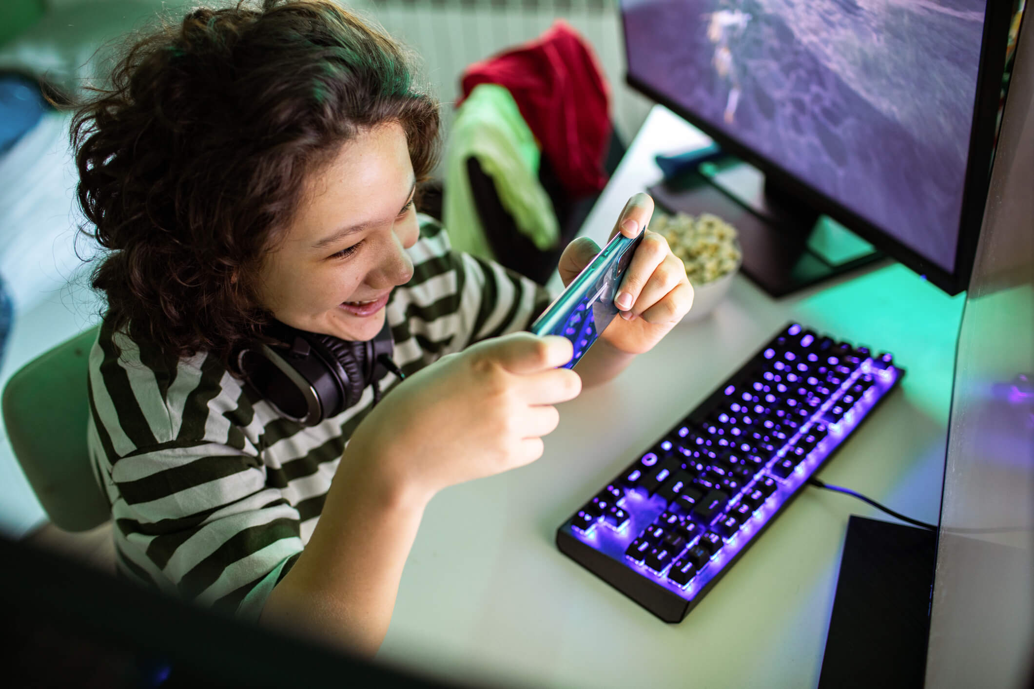 Kid playing on his mobile phone