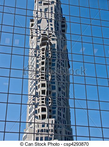 Stock Photography of Concrete Office Tower Reflected in Blue Glass.