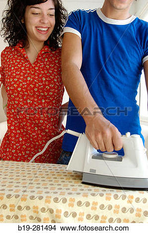 Stock Photo of Boy ironing doing housework b19.