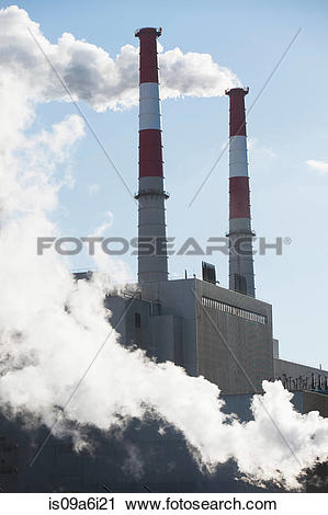 Stock Photography of Smoke billowing from industrial plant.